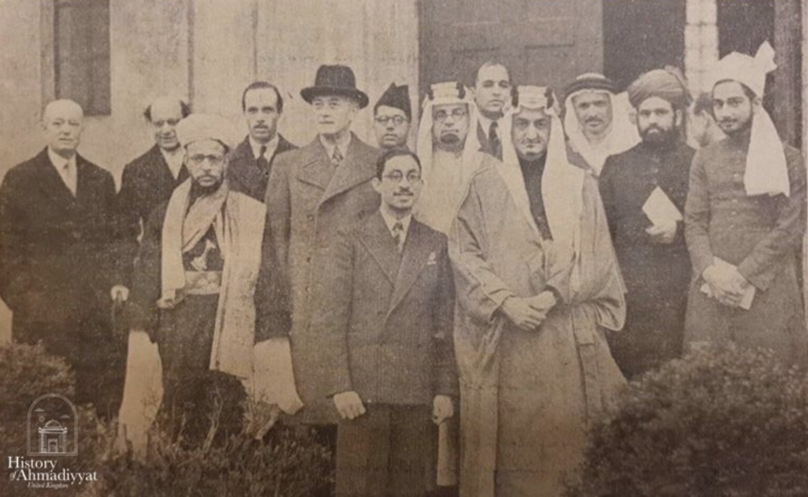 HRH Prince Faisal of Saudi Arabia, stands with several Arabian delegates during a meeting at The Fazl Mosque where the group discussed the future of Palestine in 1939. Published in the South Western Star, 17 March 1939.