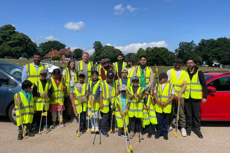Muslim youth group leads record turnout for Tilford community clean-up