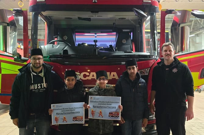 Muslim association distributes festive food to Surrey firefighters and police