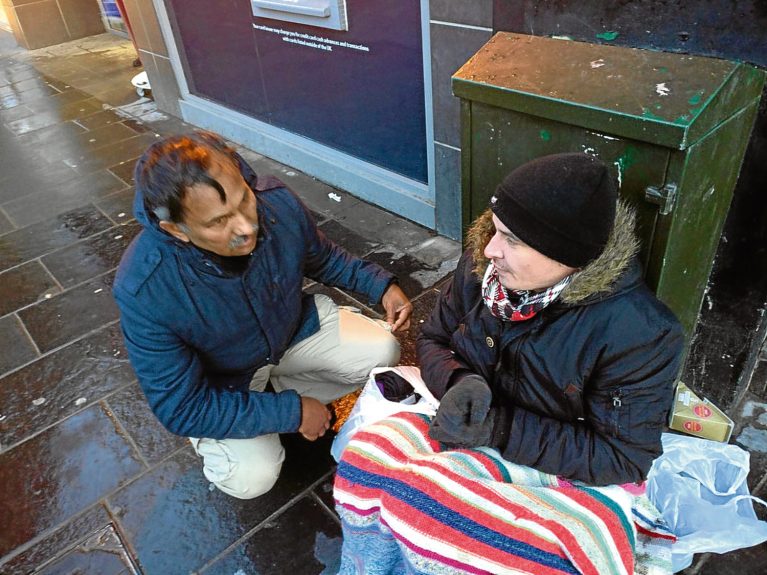 Helping the homeless as group hands out food and clothes to those on Dundee streets