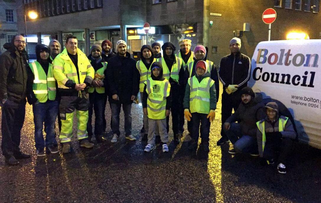 Volunteers from the Ahmadiyya Muslim Youth Association take part in big Bolton town centre clean on New Year’s Day