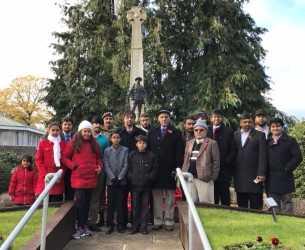 Muslim community members lay wreath