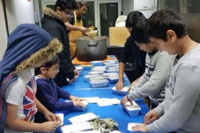 Crawley homeless helped with food served by young helpers