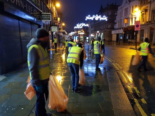 Young Muslims take to streets to clean up after New Year’s Eve celebrations