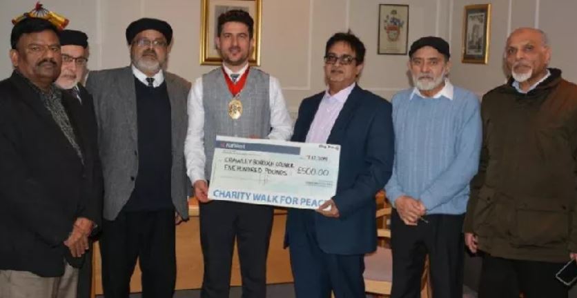 Crawley Muslim group donates money to help people with dementia