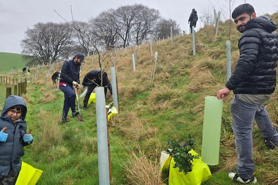 Muslim youth brave rain to support Ribble Rivers Trust tree-planting initiative